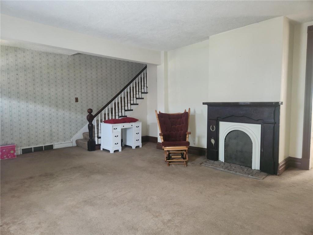 307 North 3rd Street Apollo, PA 15613 - Photo 2 of 17 a living room with furniture and a fireplace