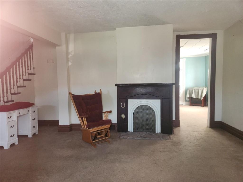 307 North 3rd Street Apollo, PA 15613 - Photo 3 of 17 a living room with furniture and a fireplace
