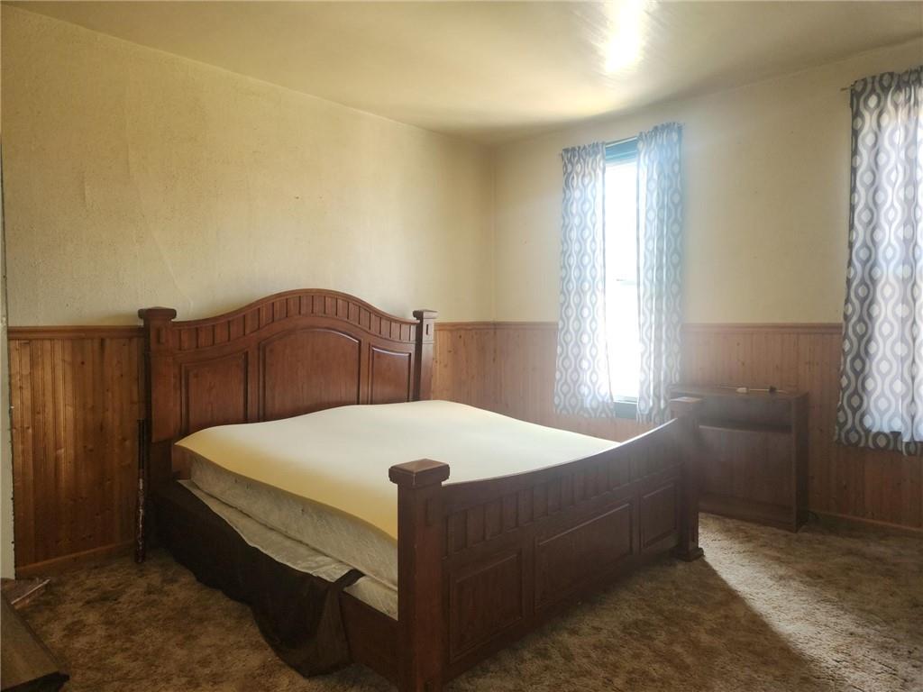 307 North 3rd Street Apollo, PA 15613 - Photo 10 of 17 a bed sitting in a bedroom next to a window