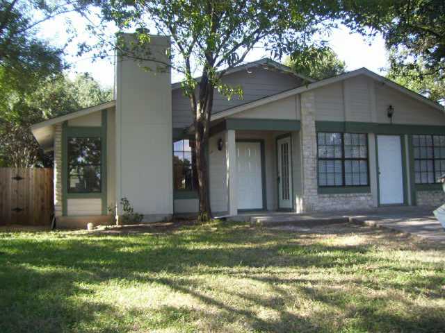a view of a backyard of the house
