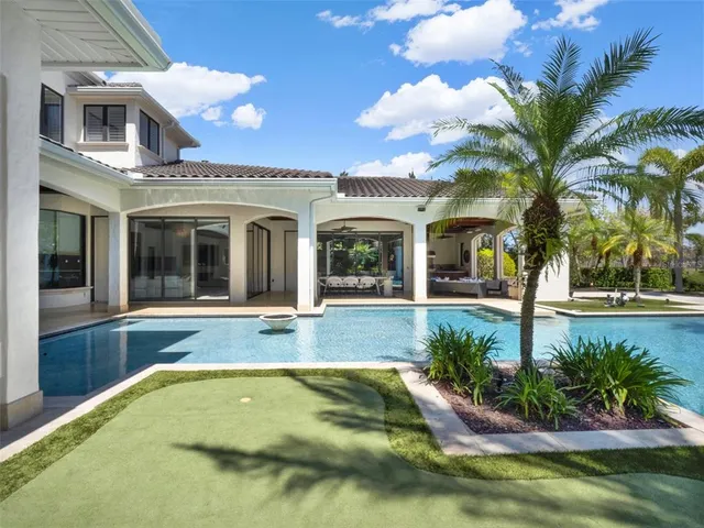 a view of pool with brick walls