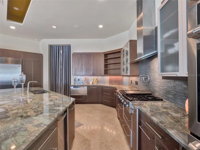 a dining room with furniture a rug and a large window