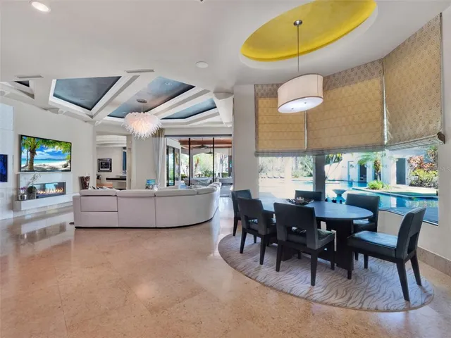 a large swimming pool with outdoor seating and a couch