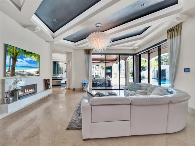 a living room with furniture and pool table