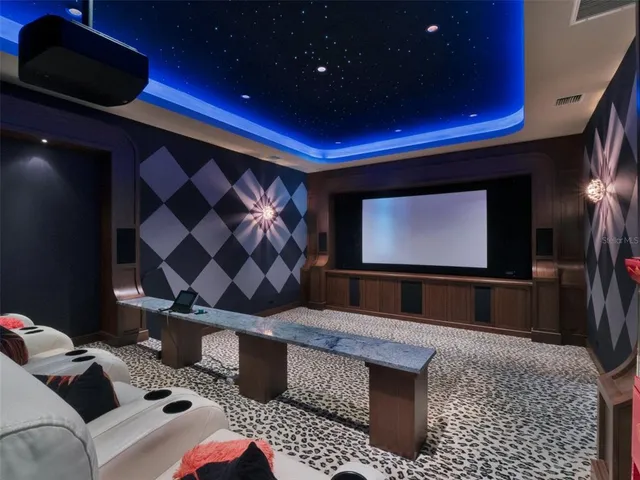 a large bathroom with a granite countertop sink a toilet a mirror and bathtub