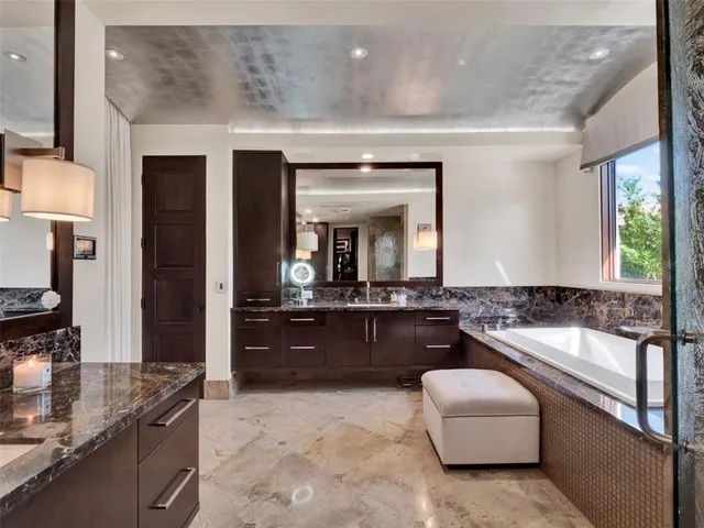 a kitchen with stainless steel appliances granite countertop a stove and a refrigerator