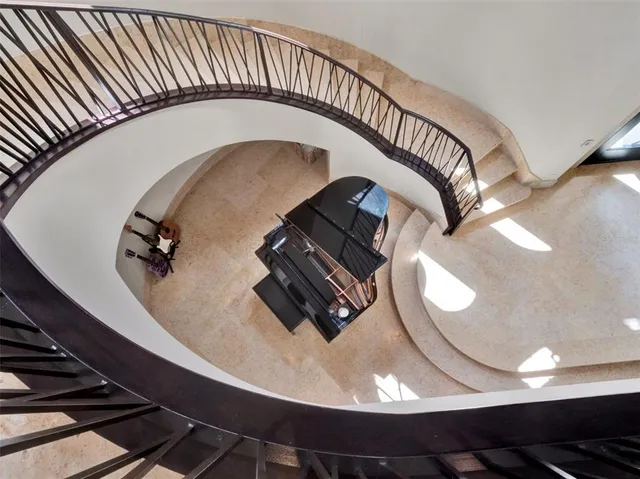 a bathroom with a sink a toilet a mirror and shower