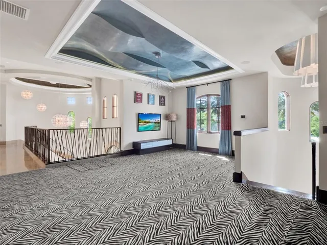 a living room with furniture fireplace and flat screen tv