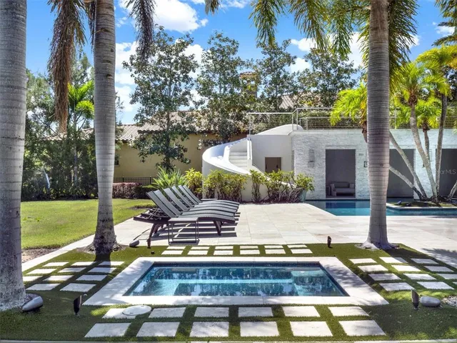 a view of a house with swimming pool