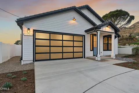 a front view of a house with a garage
