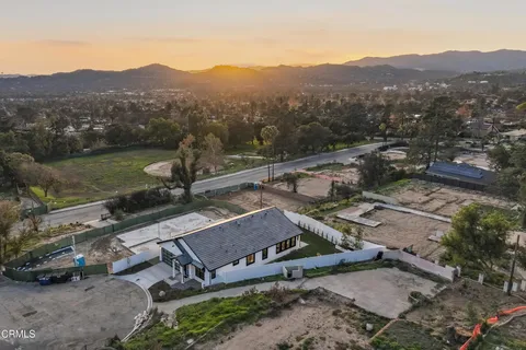 an aerial view of a house with a garden