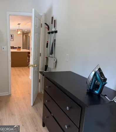 a view of a kitchen with a sink and a refrigerator