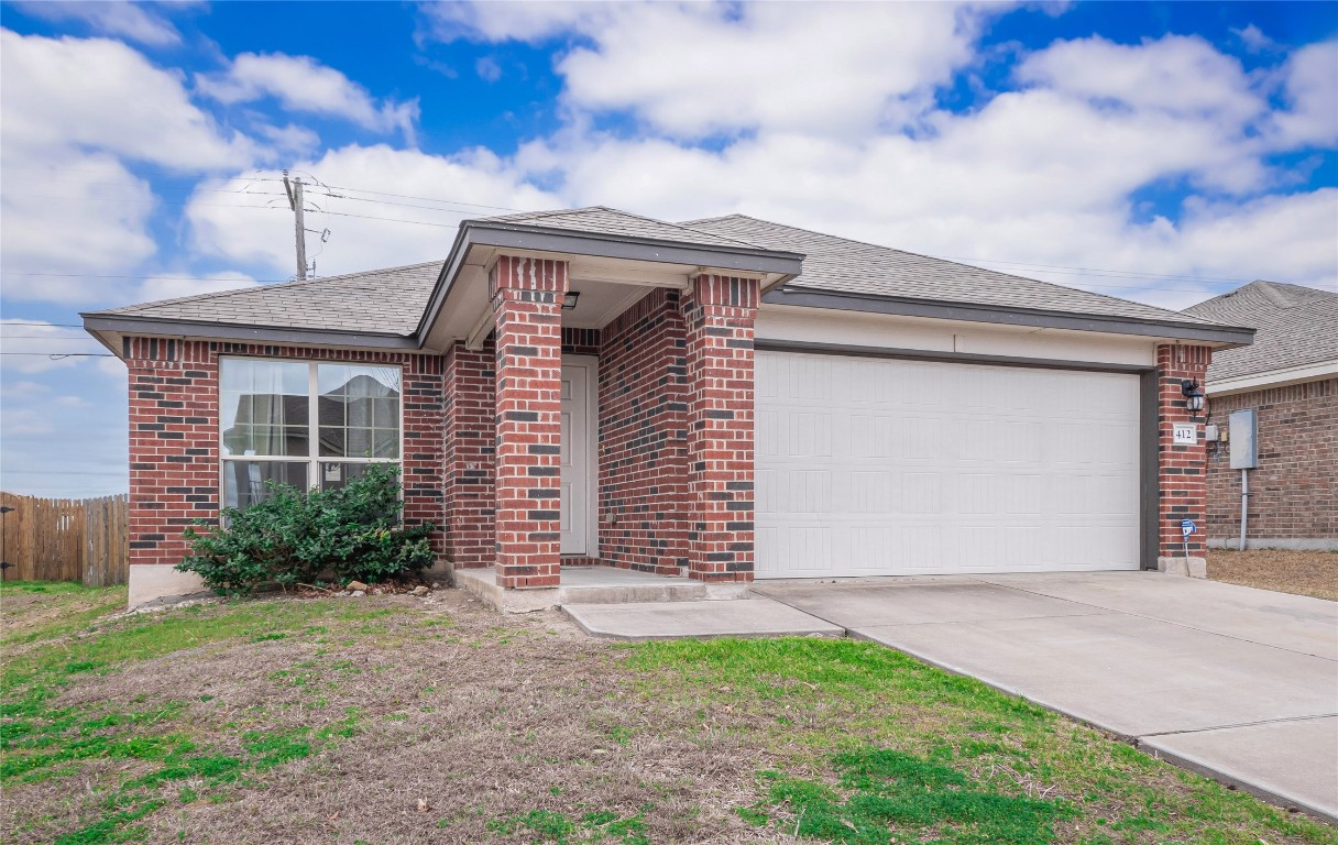 412 Amber Lane Jarrell, TX 76537 - Photo 1 of 1 a front view of a house with garden