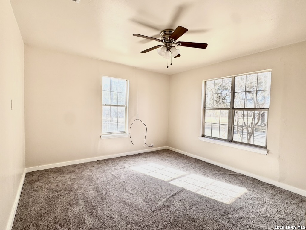 19524 South Benton Street Lytle, TX 78052 - Photo 17 of 22 a view of an empty room with a window