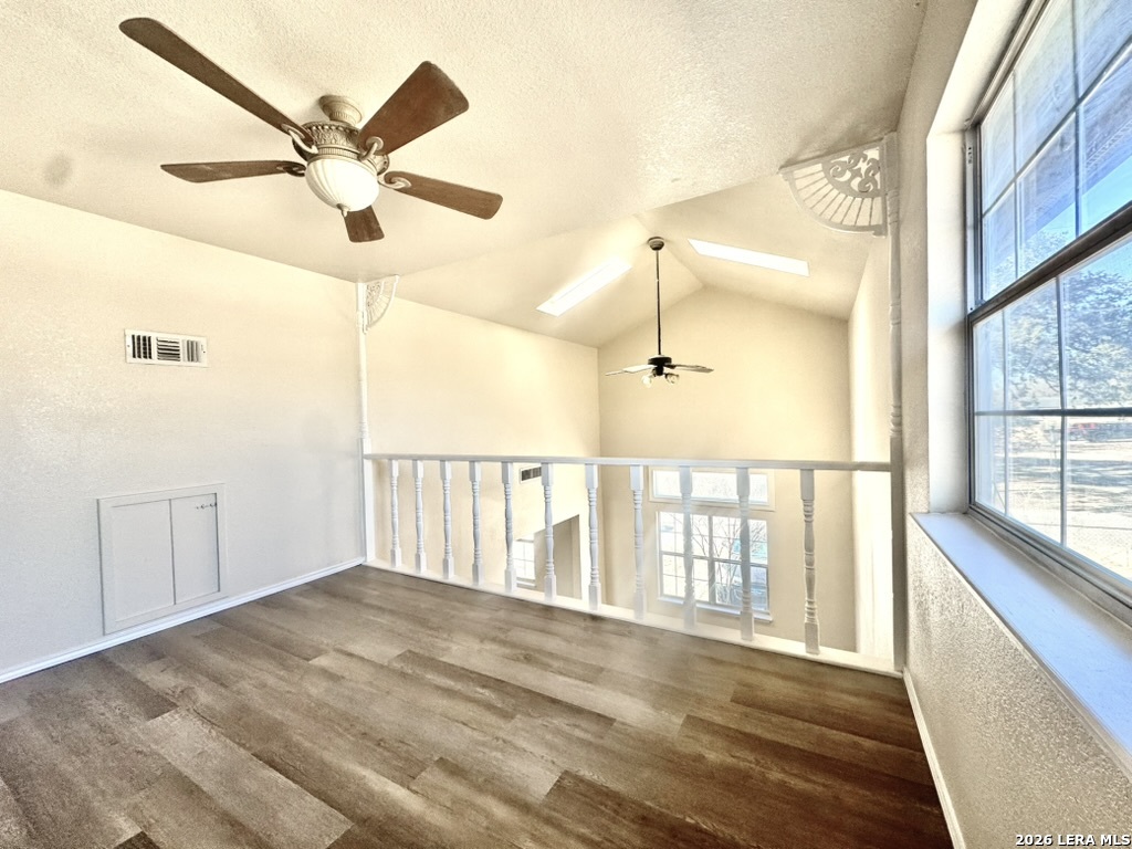 19524 South Benton Street Lytle, TX 78052 - Photo 20 of 22 an empty room with wooden floor fan and windows