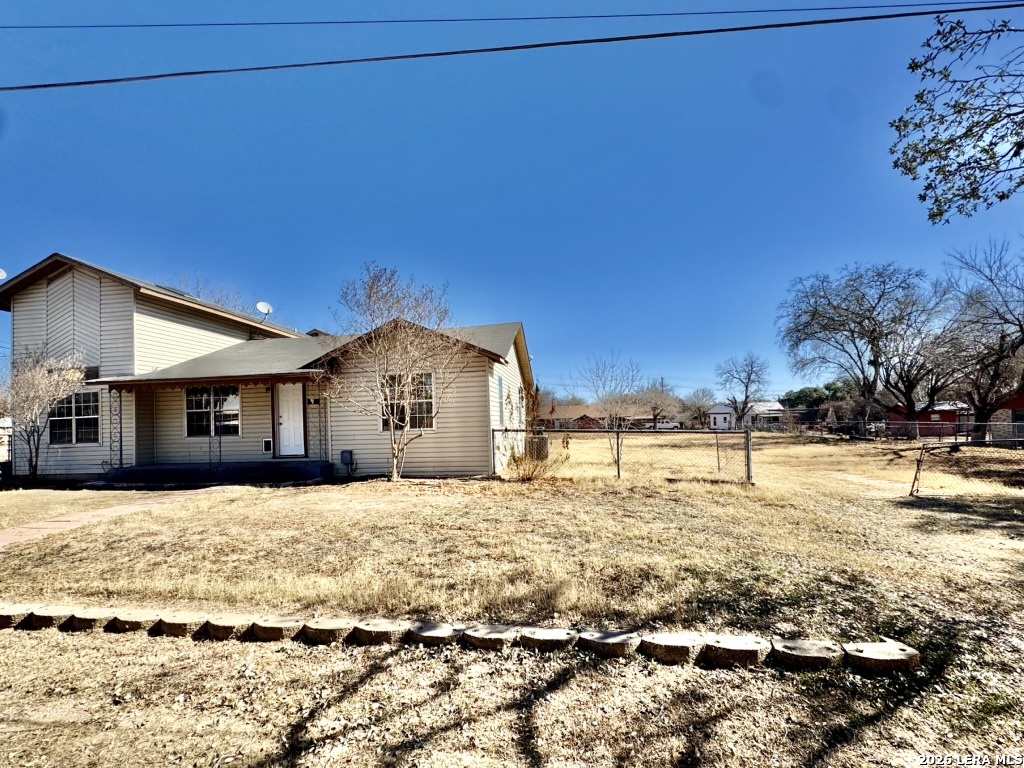 19524 South Benton Street Lytle, TX 78052 - Photo 22 of 22 a view of a house with a yard covered with snow in front of house