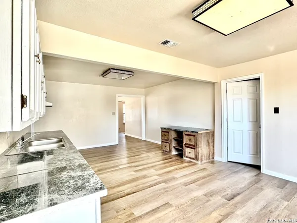 a view of a livingroom with furniture and a fireplace