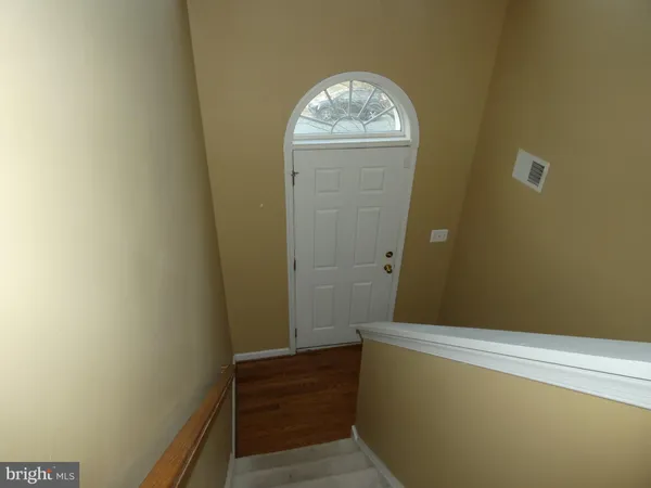 a view of door with wooden floor