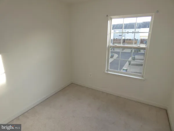 an empty room with a shower