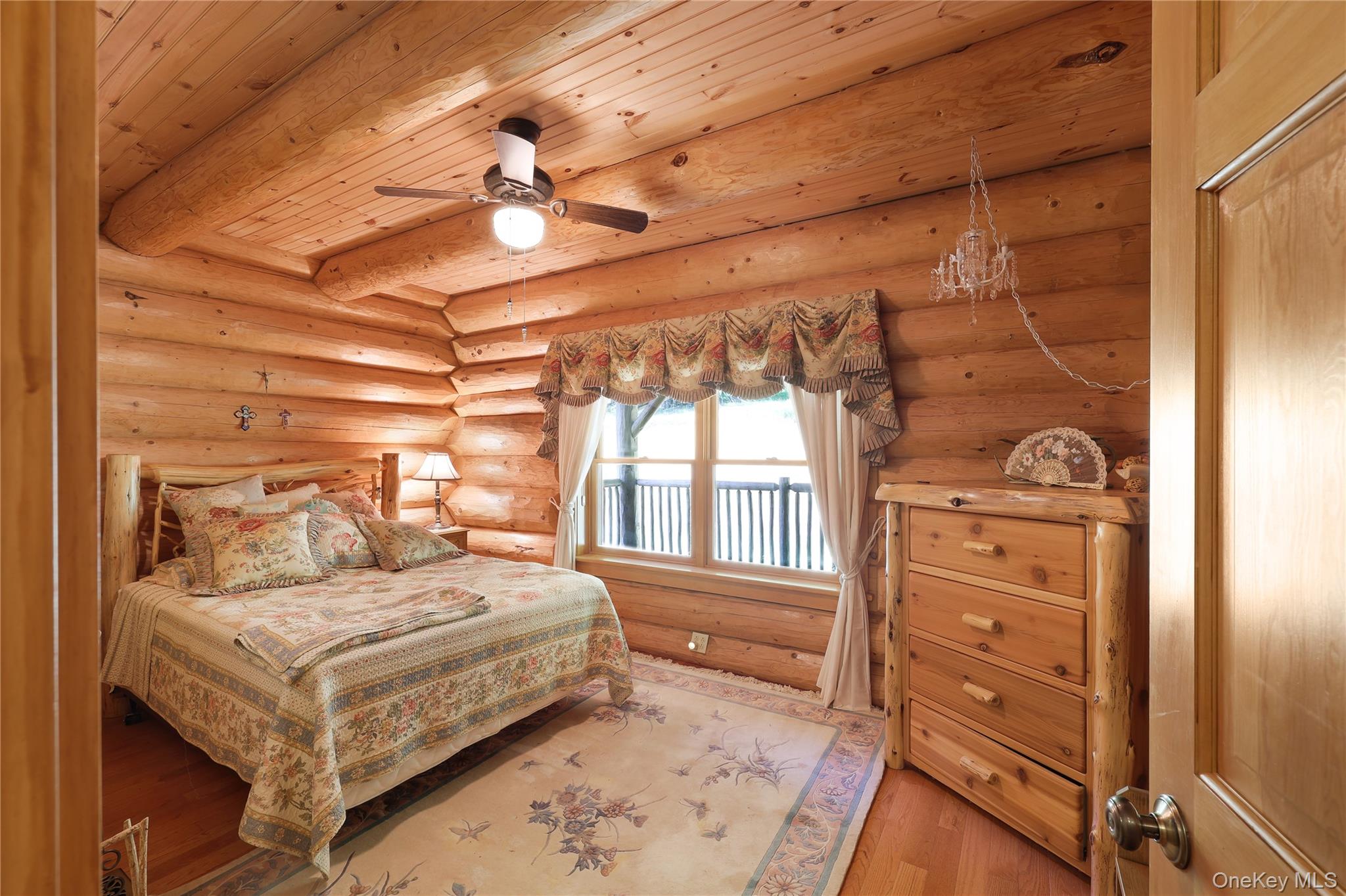 25 Cauthers Road Fallsburg, NY 12789 - Photo 16 of 27 a bedroom with a bed and a dresser next to a window