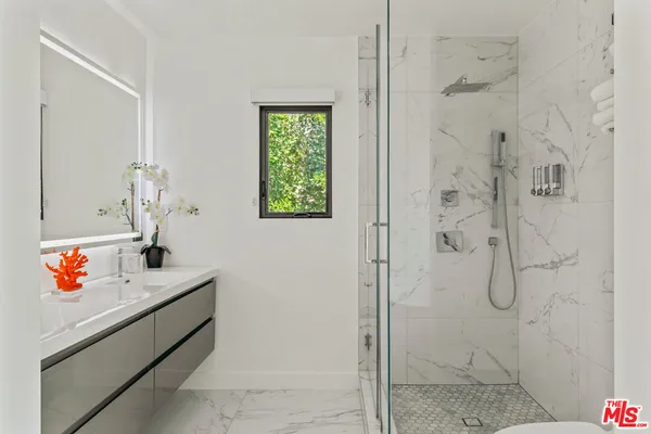 a bathroom with a sink and a shower