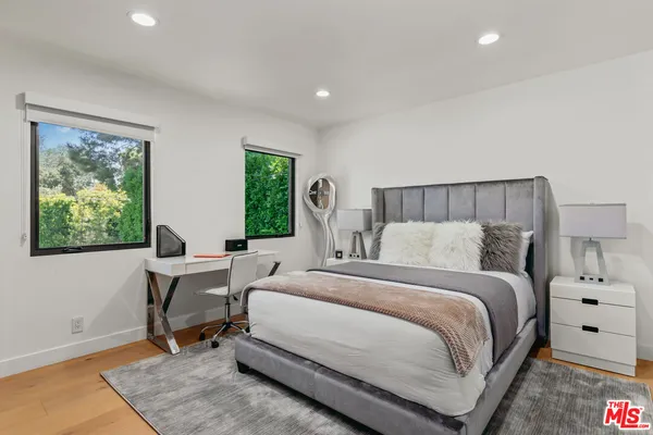 a bed room with a bed and a table