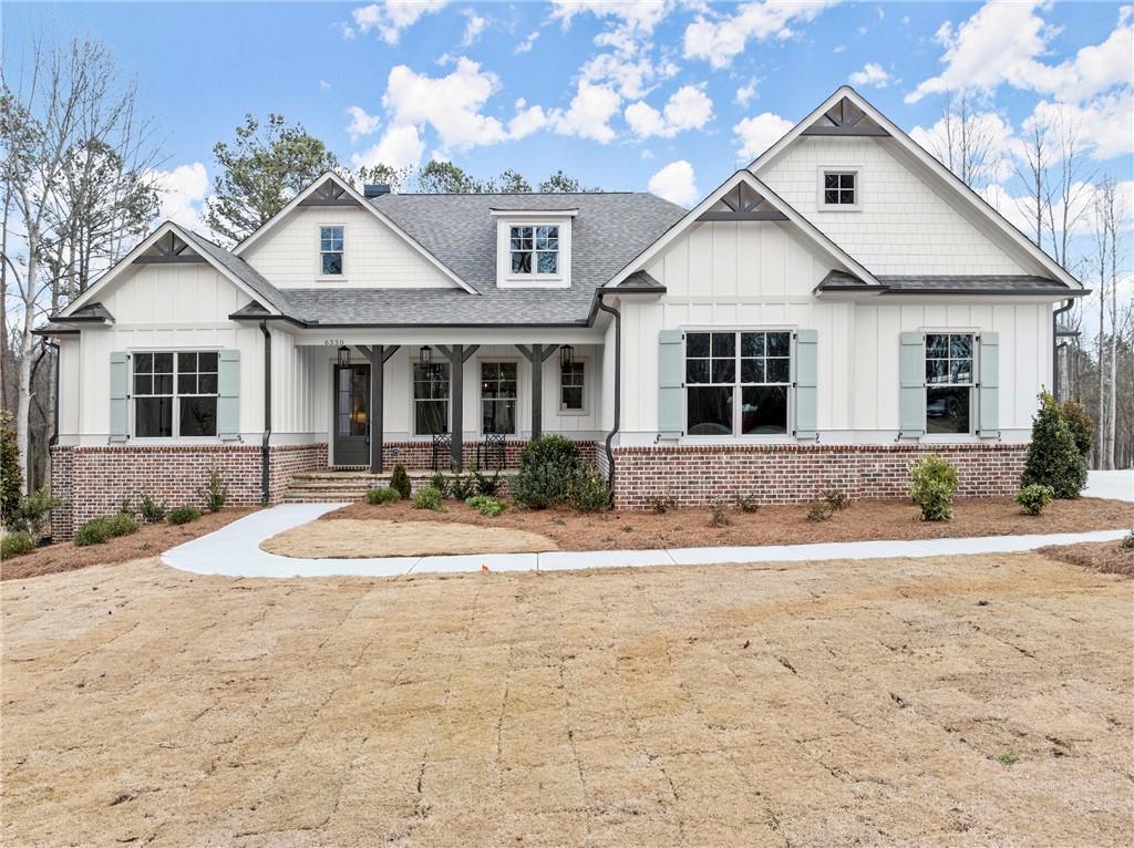 6359 Little Mill Road Gainesville, GA 30506 - Photo 1 of 1 a front view of a house with a yard and potted plants