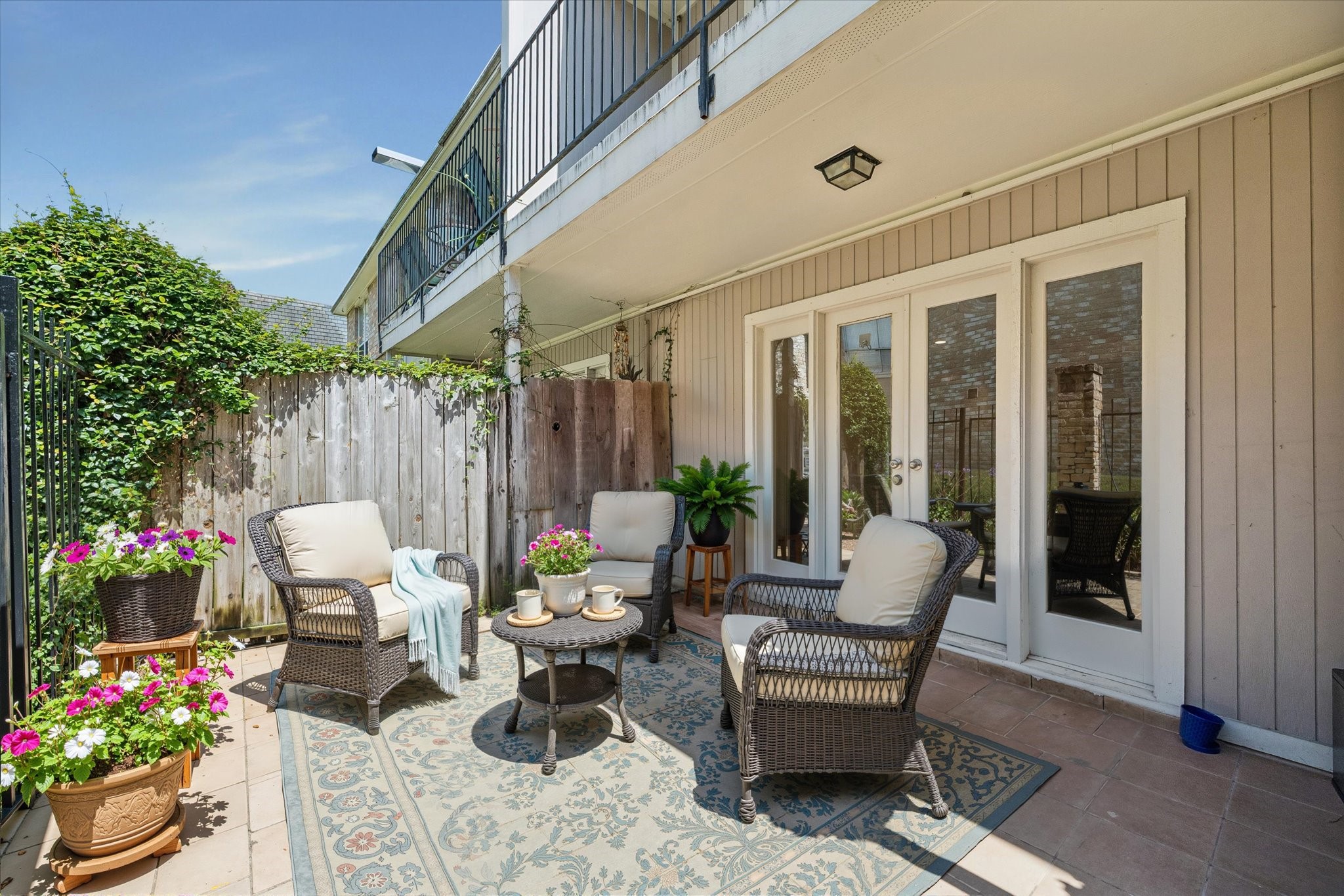 2230 South Piney Point Road, Unit 103 Houston, TX 77063 - Photo 8 of 28 Very spacious and cozy patio with - fully gated with tile. (this photo is virtually staged)