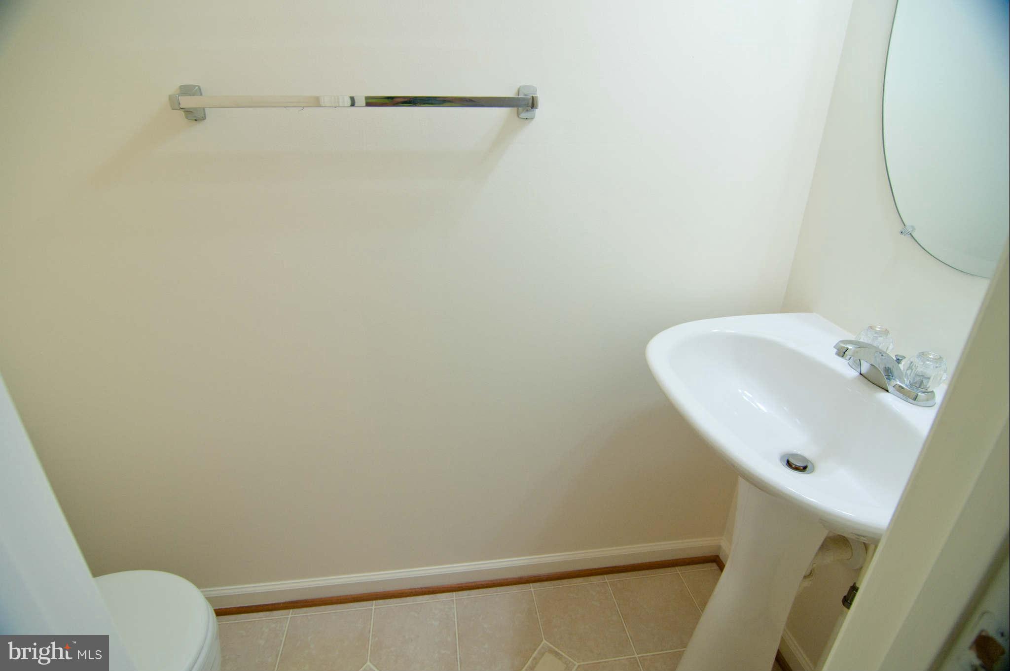 9661 Biggs Road Baltimore, MD 21220 - Photo 11 of 25 a bathroom with a sink and a mirror