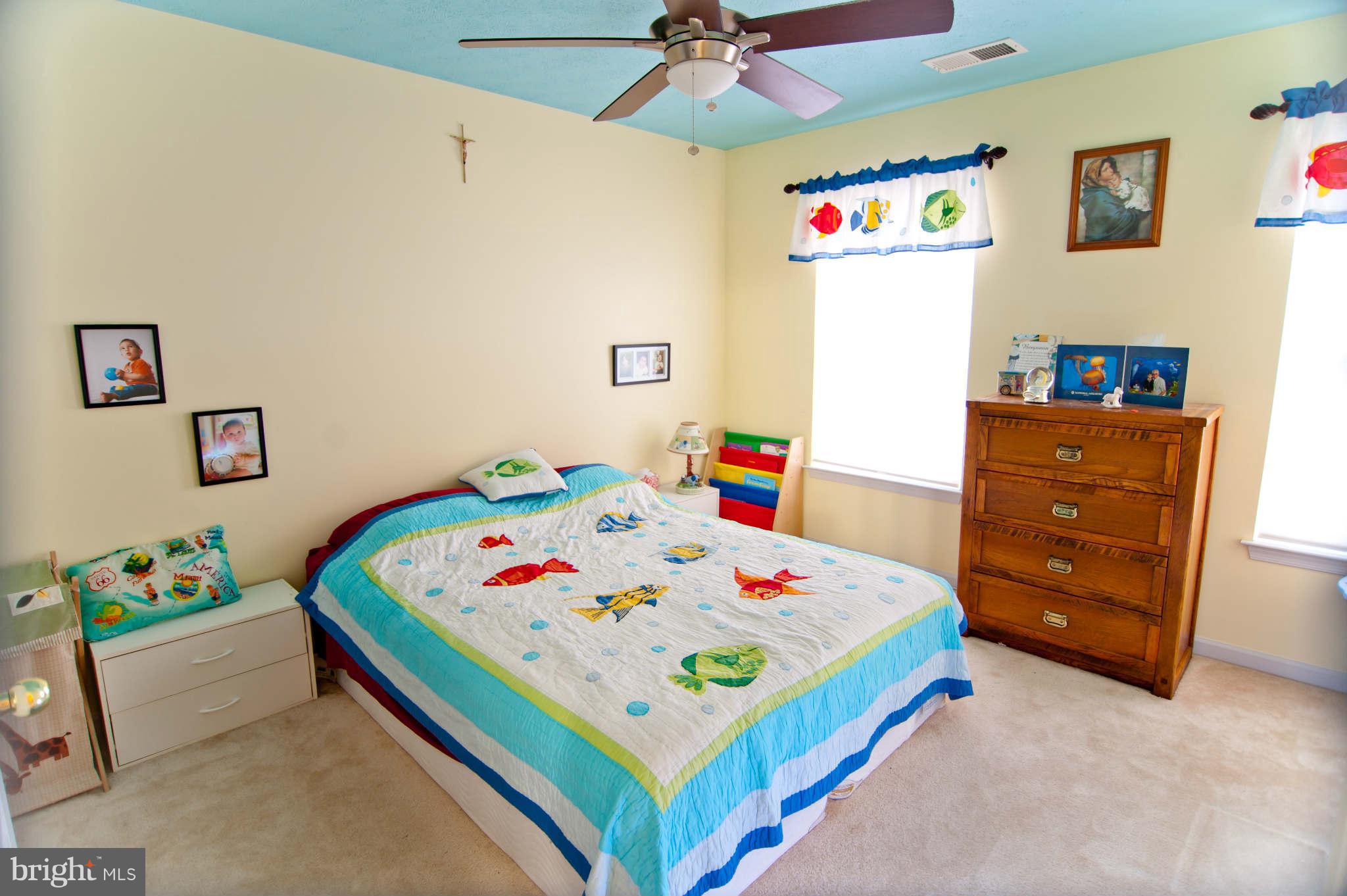 9661 Biggs Road Baltimore, MD 21220 - Photo 12 of 25 a bedroom with a bed and dresser