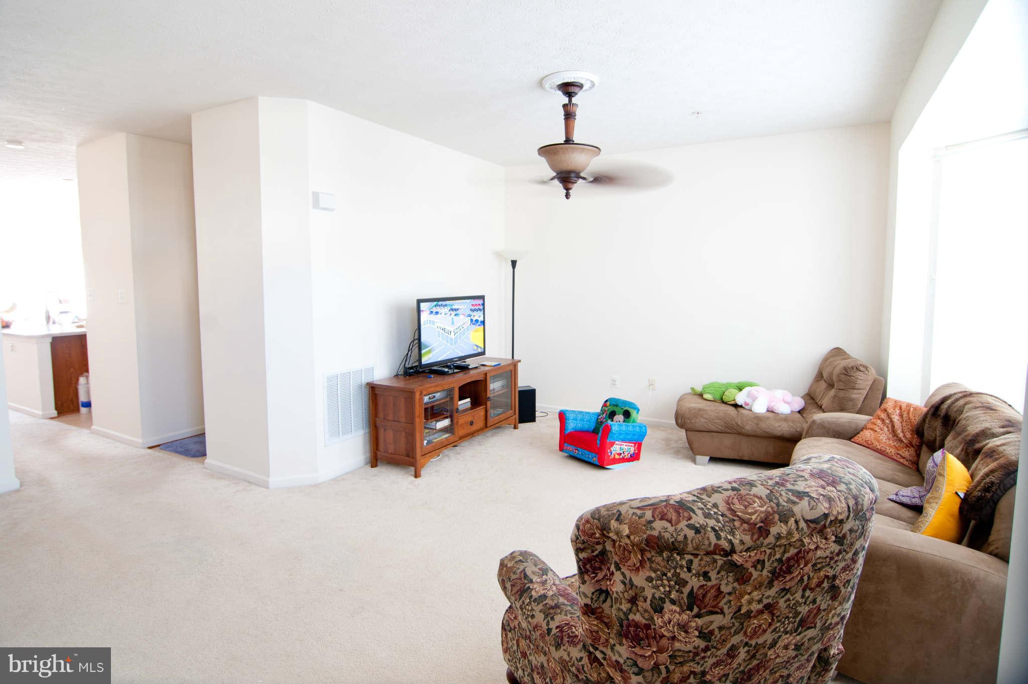 9661 Biggs Road Baltimore, MD 21220 - Photo 4 of 25 a bedroom with furniture and a chandelier