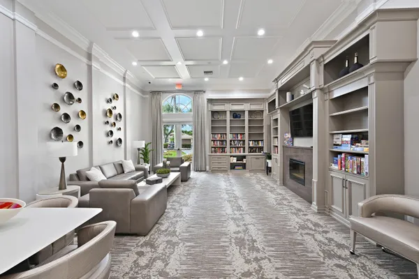 a living room with furniture cabinets and window
