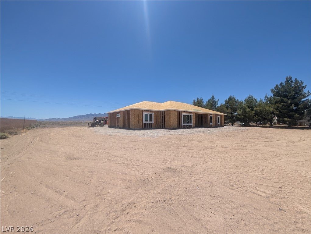 1120 West Gamebird Road Pahrump, NV 89048 - Photo 4 of 36 A newly framed single-story residence awaits finishing touches on a spacious desert lot.