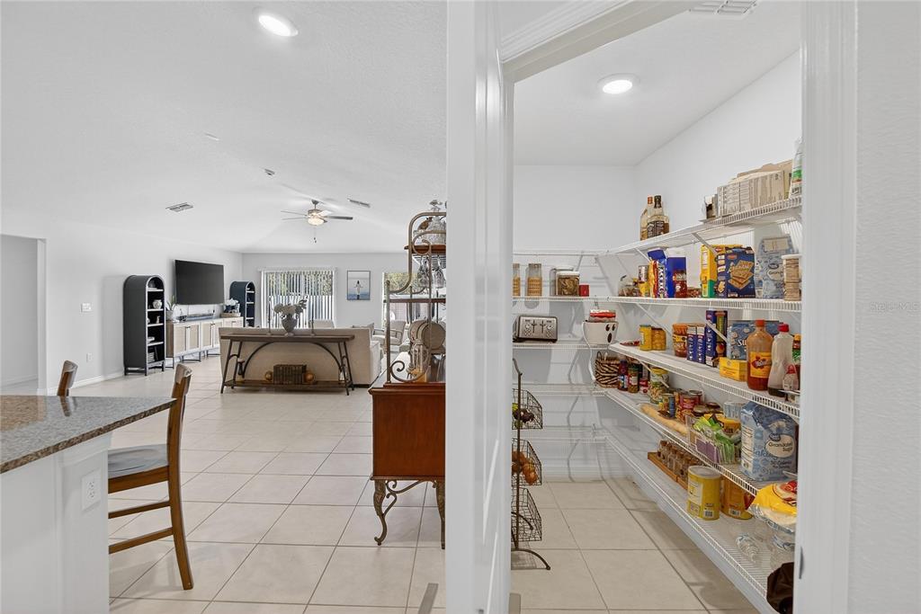 2950 Flying Blackbird Road Bartow, FL 33830 - Photo 15 of 41 a living room with furniture and a book shelf