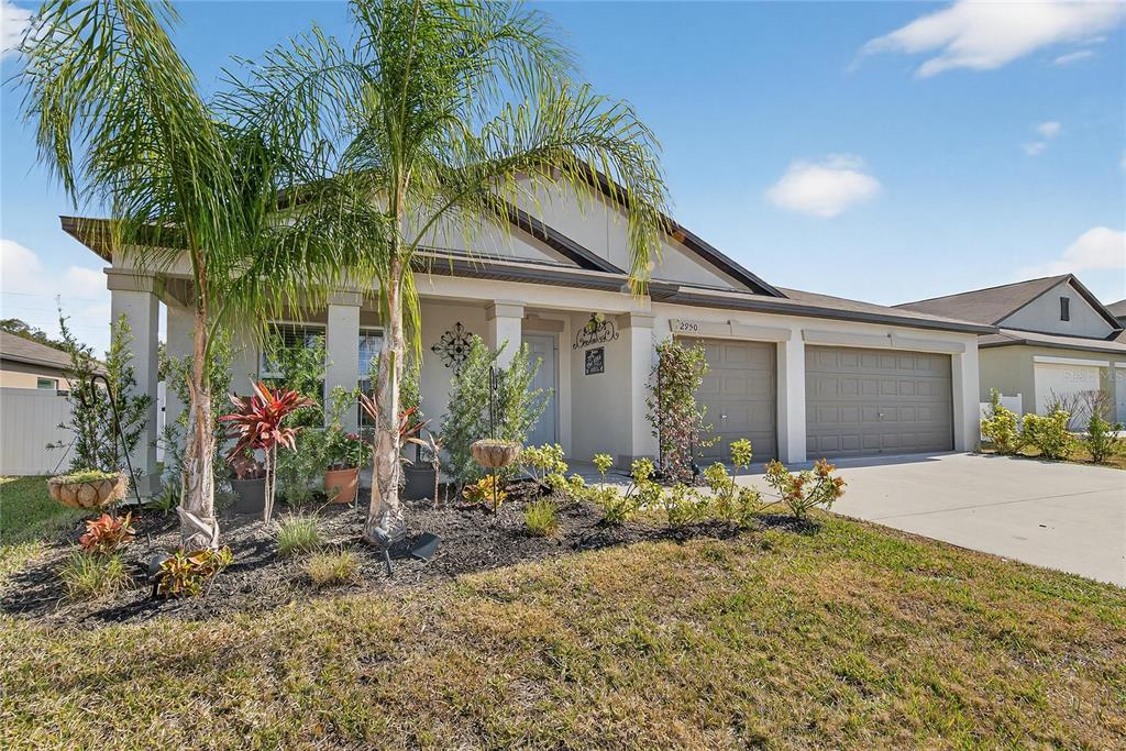 2950 Flying Blackbird Road Bartow, FL 33830 - Photo 2 of 41 a front view of a house with garden