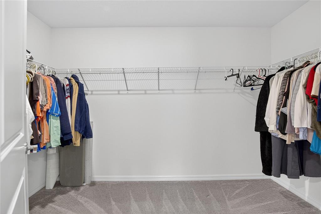 2950 Flying Blackbird Road Bartow, FL 33830 - Photo 28 of 41 a view of walk in closet with clothes
