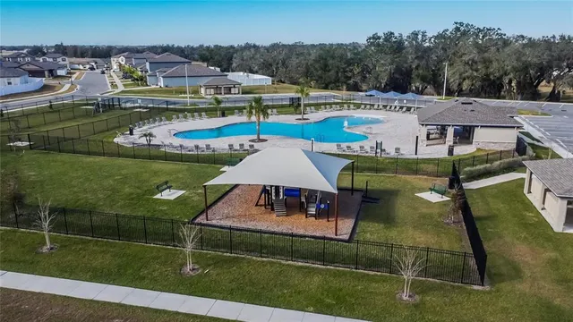 an aerial view of a house with garden space and houses