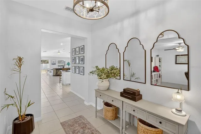 a kitchen with stainless steel appliances granite countertop a sink a stove and a wooden floors
