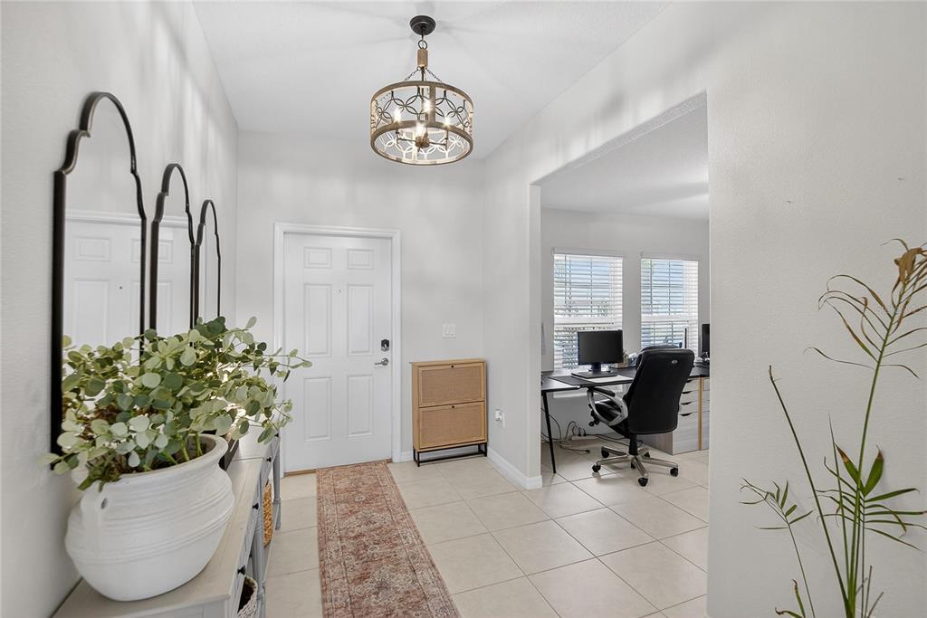 2950 Flying Blackbird Road Bartow, FL 33830 - Photo 7 of 41 a view of a workspace with furniture and a potted plant