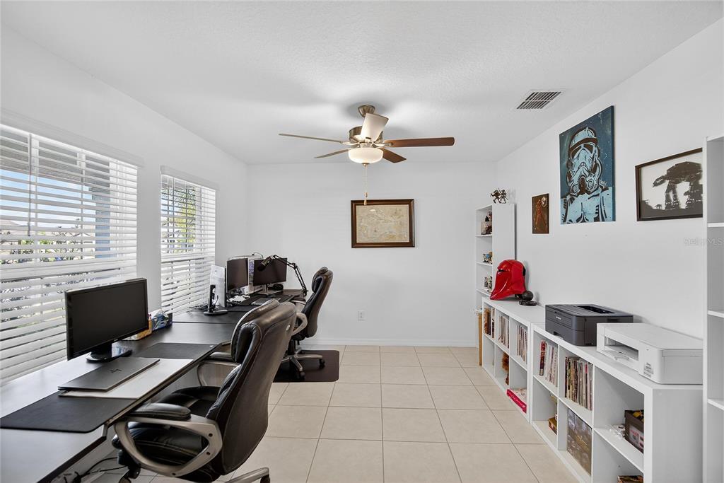 2950 Flying Blackbird Road Bartow, FL 33830 - Photo 8 of 41 a view of a workspace with furniture and a window