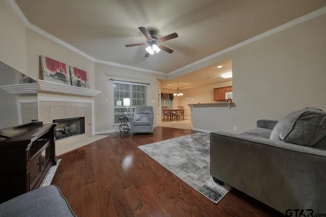 a living room with furniture and a fireplace