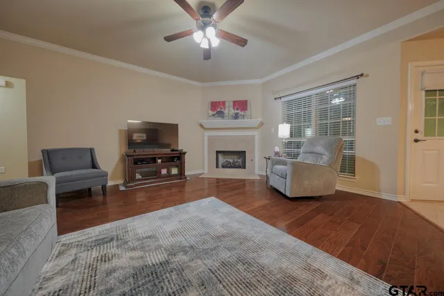 a living room with furniture and a flat screen tv