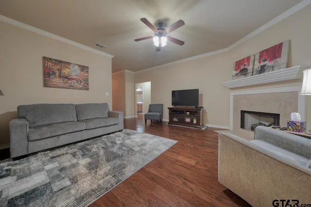 a living room with furniture and a flat screen tv