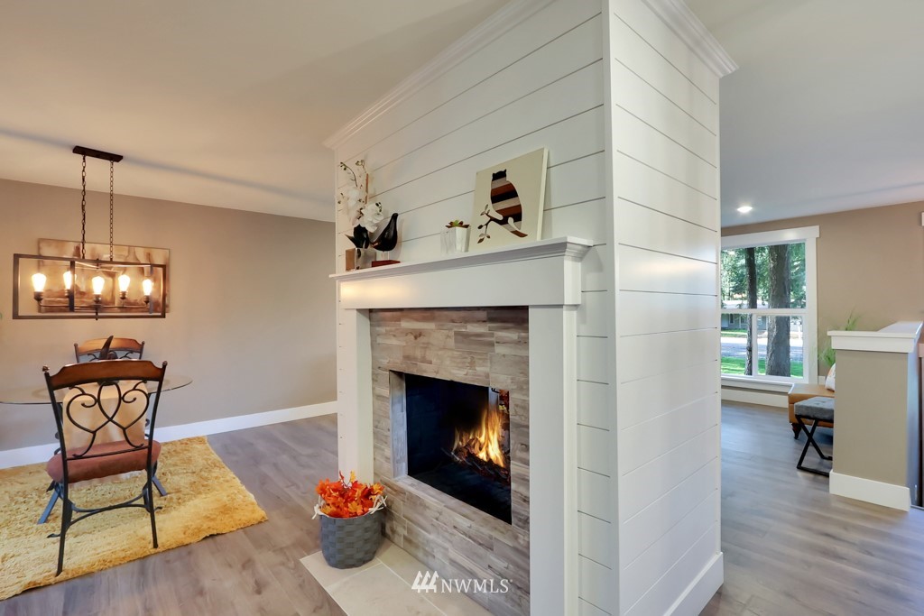 14628 164th Place Southeast Renton, WA 98059 - Photo 14 of 34 a living room with furniture and a fireplace