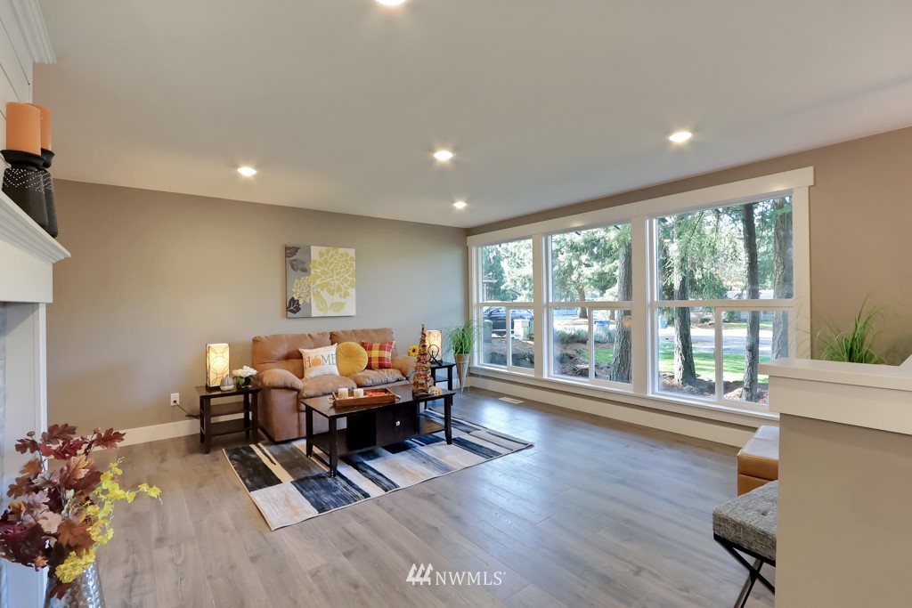 14628 164th Place Southeast Renton, WA 98059 - Photo 8 of 34 a living room with furniture and wooden floor