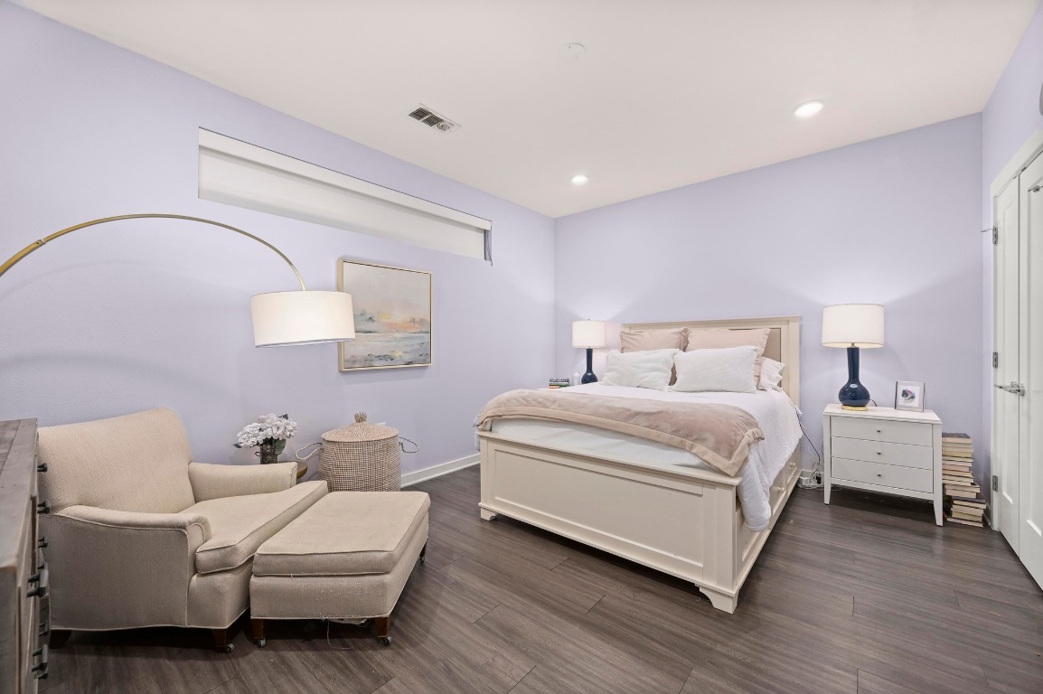 4361 South Congress Avenue, Unit 427 Austin, TX 78745 - Photo 12 of 33 a bedroom with a bed and a mirror