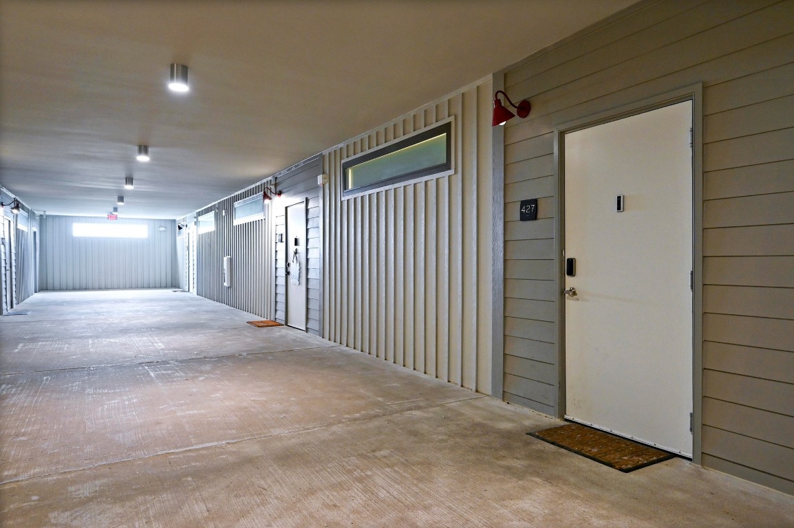 4361 South Congress Avenue, Unit 427 Austin, TX 78745 - Photo 19 of 33 a view of a hallway with wooden floor