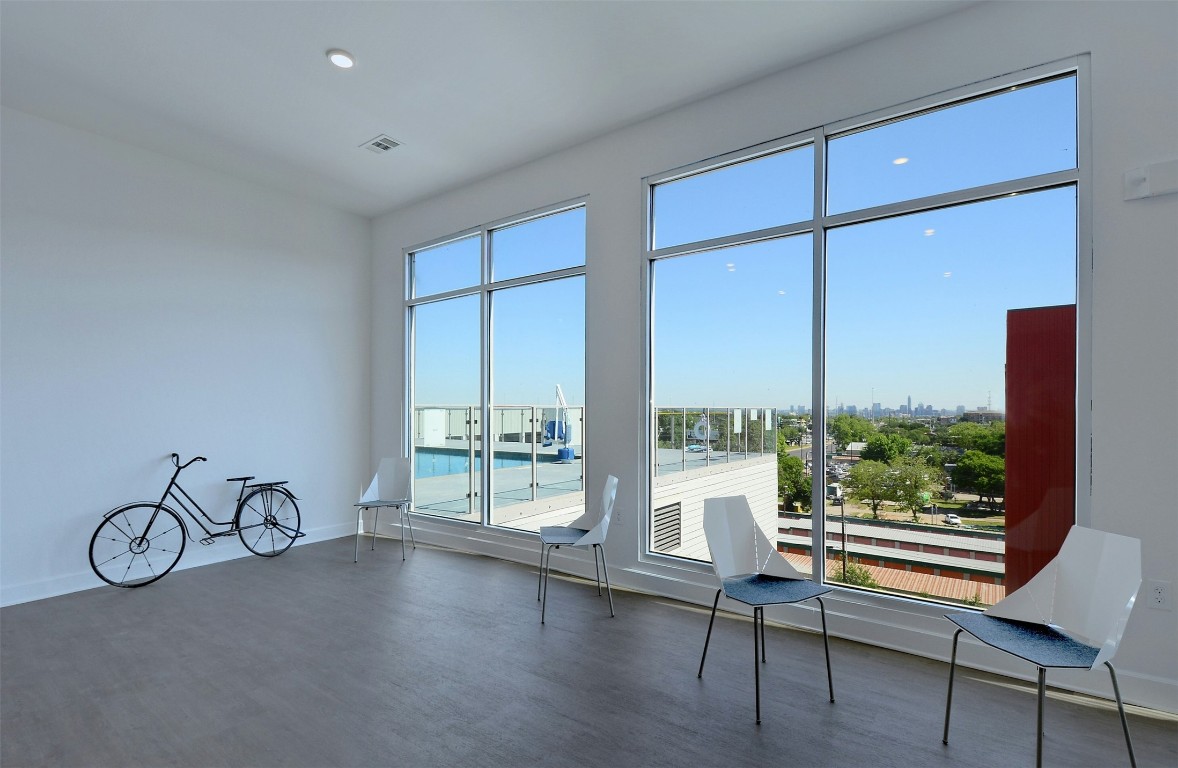 4361 South Congress Avenue, Unit 427 Austin, TX 78745 - Photo 26 of 33 a very nice looking room with a large window and white walls