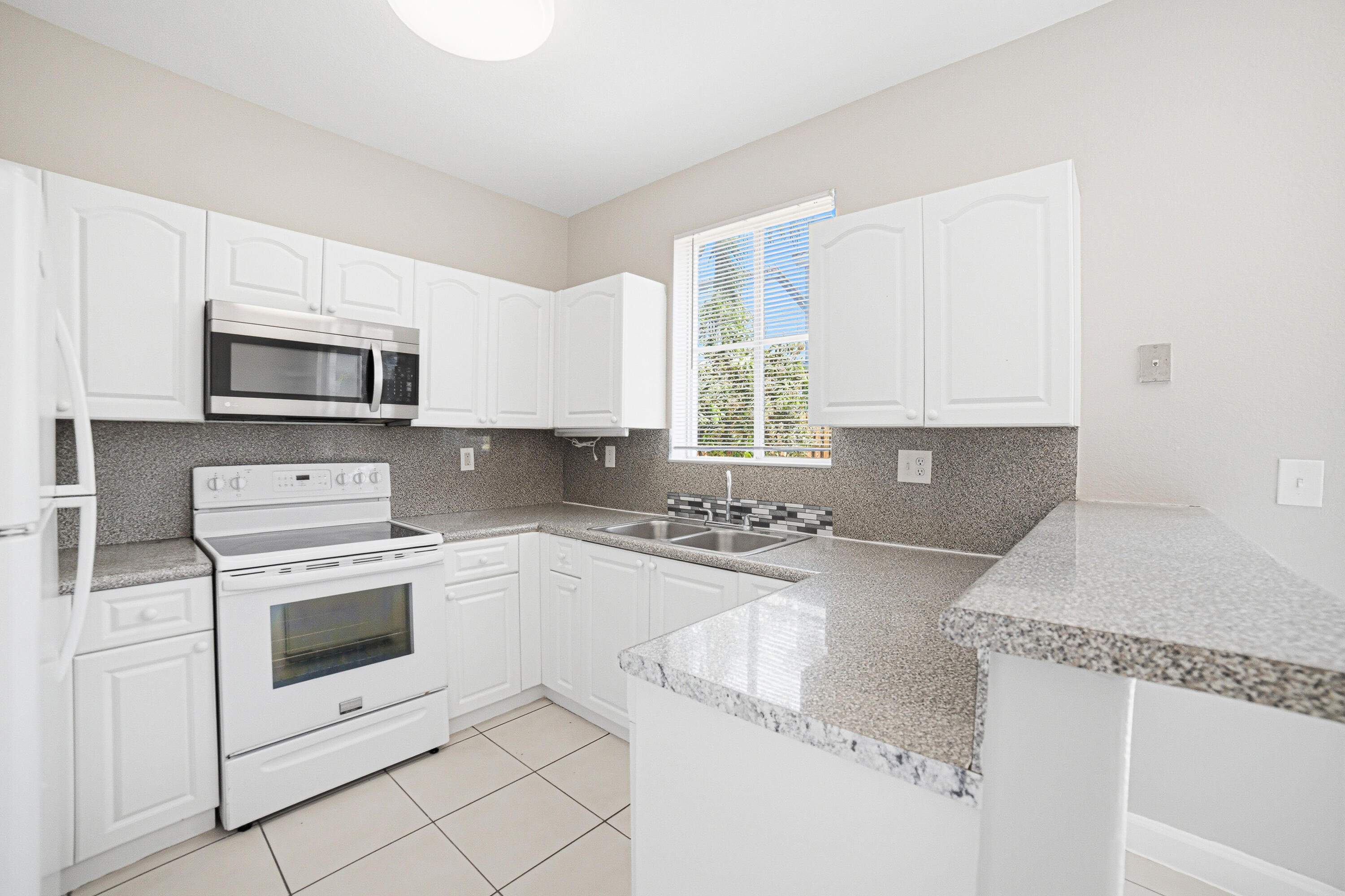 7301 Northwest 174th Terrace, Unit 100 Hialeah, FL 33015 - Photo 6 of 16 Kitchen