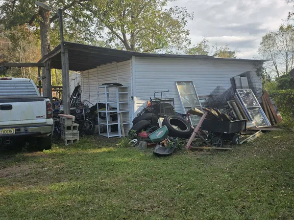 a view of a two chairs in the back yard